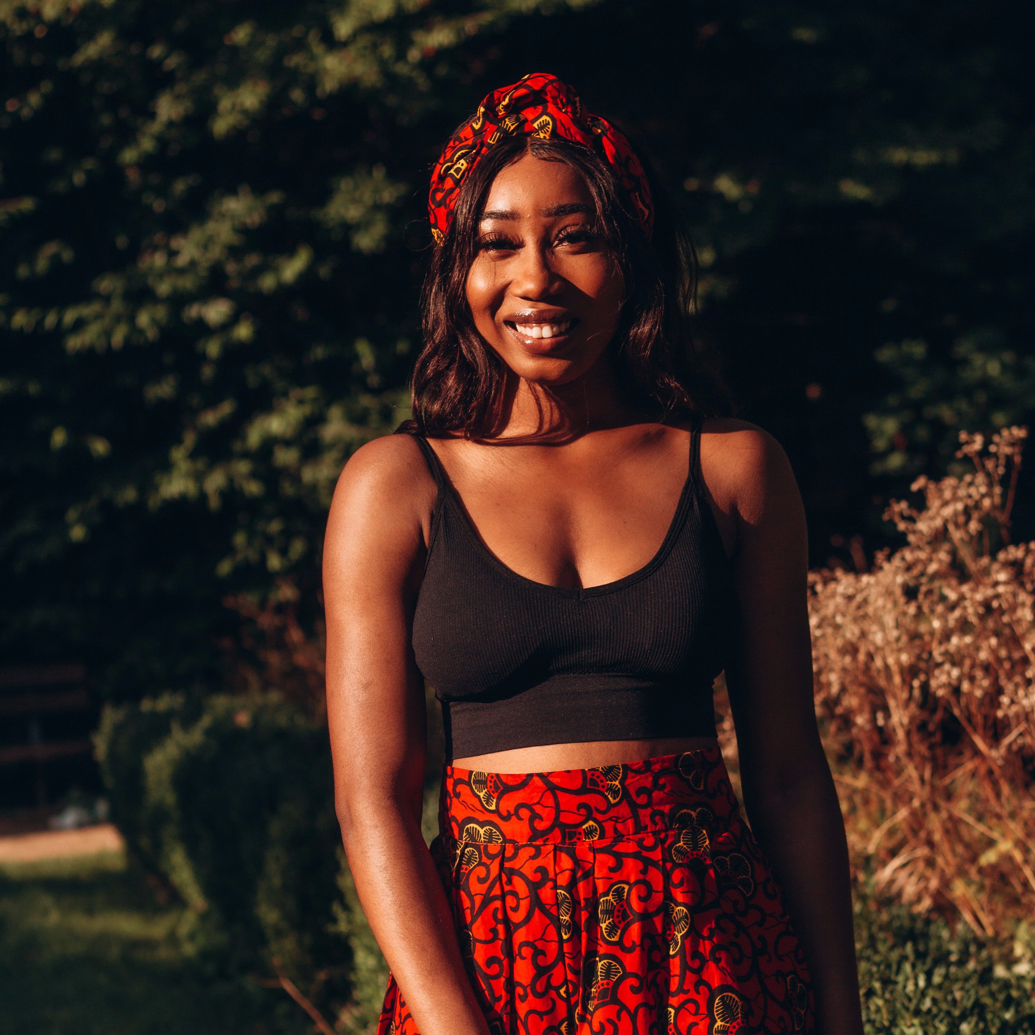 Red crop top store and black skirt